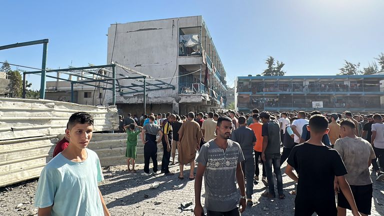 Palestinians inspect a school sheltering displaced people, after it was hit by an Israeli strike in Gaza's Nuseirat.
Pic: Reuters