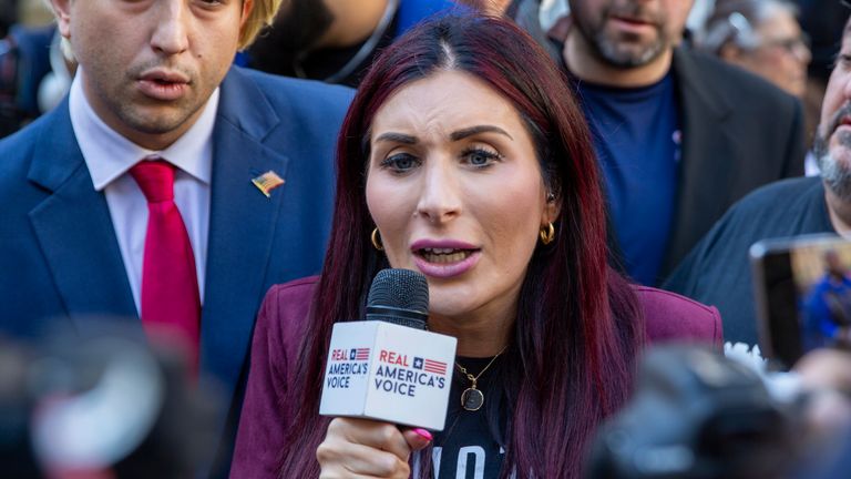 Right-wing activist Laura Loomer is in front of the courthouse where the hush-money trial of Donald Trump got underway Monday, April 15, 2024, in New York. (AP Photo/Ted Shaffrey)